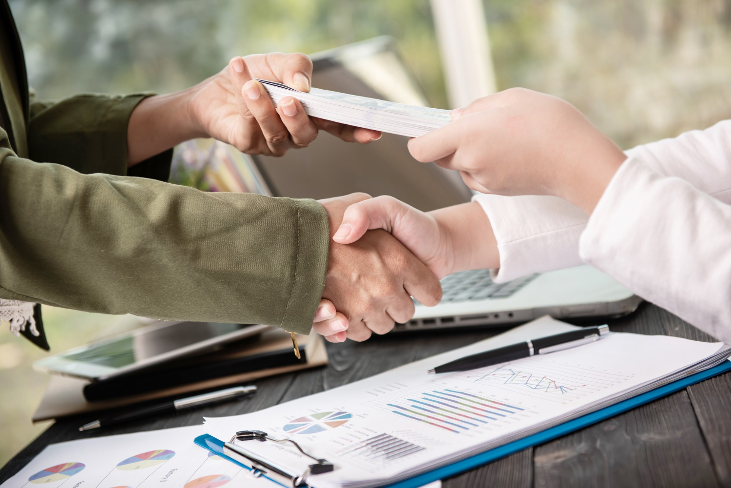 business-people-shaking-hands-finishing-up-meeting-1